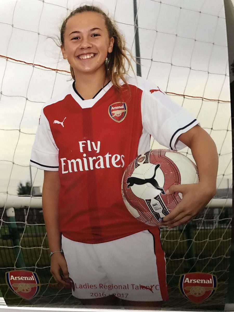 Wiktoria aged 14 in an Arsenal kit, holding a football