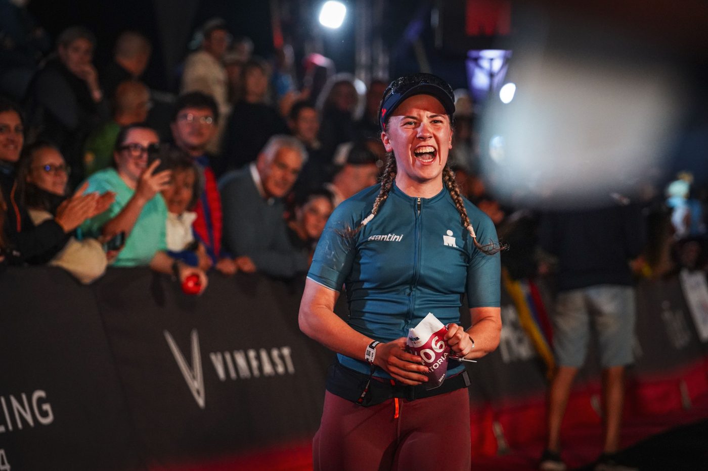 Wiktoria smiling while crossing the Ironman finish line